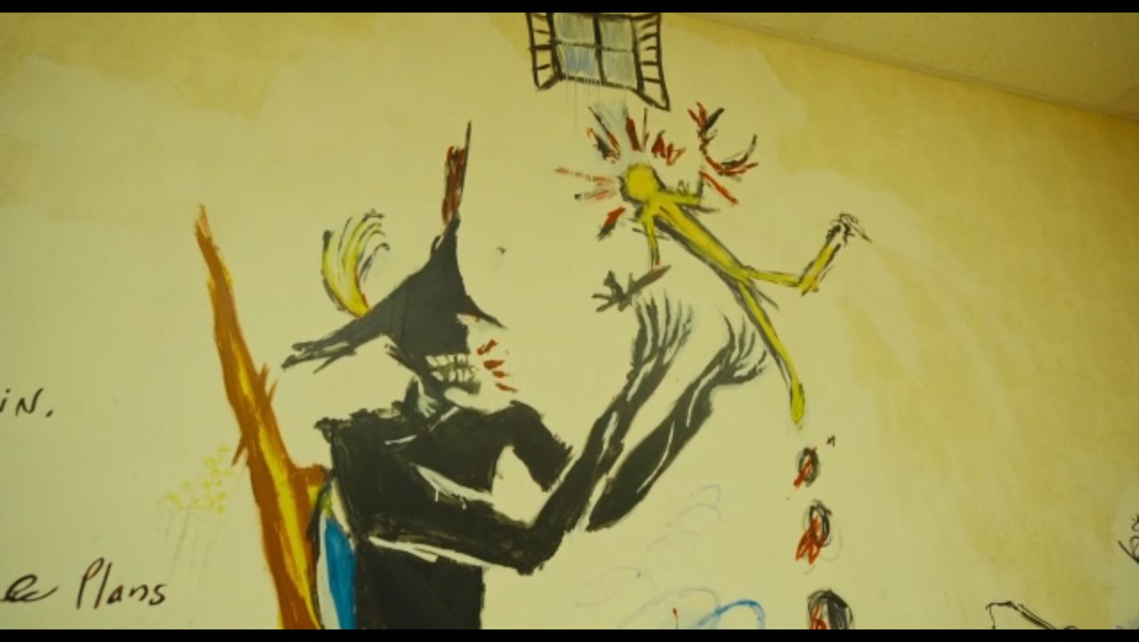 Mural close-up: a black figure in a three-cornered hat reaching for a yellow man, a window above